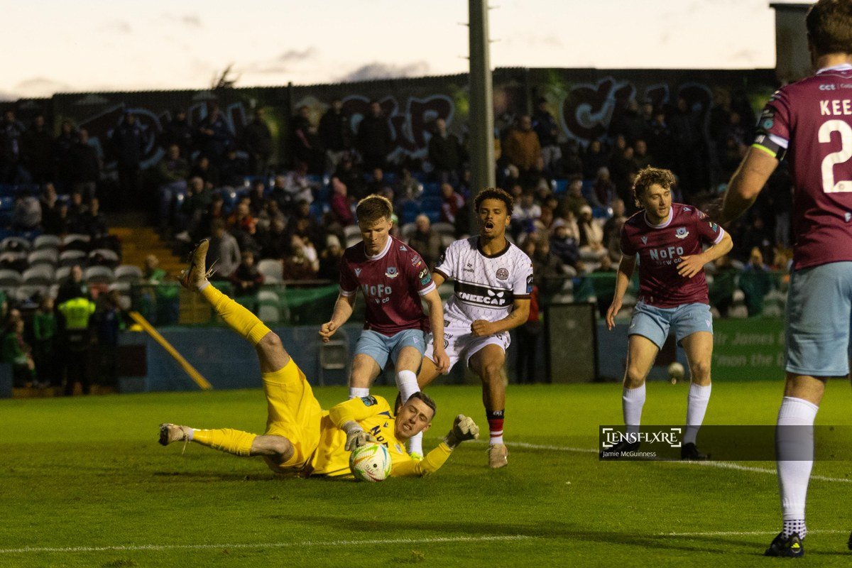 Drogheda United FC's goalkeeper Luke Dennison dives low to save a Bohemian FC cross during the SSE Airtricity League Men's Premier Division match between Drogheda United FC and Bohemian Football Club at Sullivan &amp; Lambe Park.